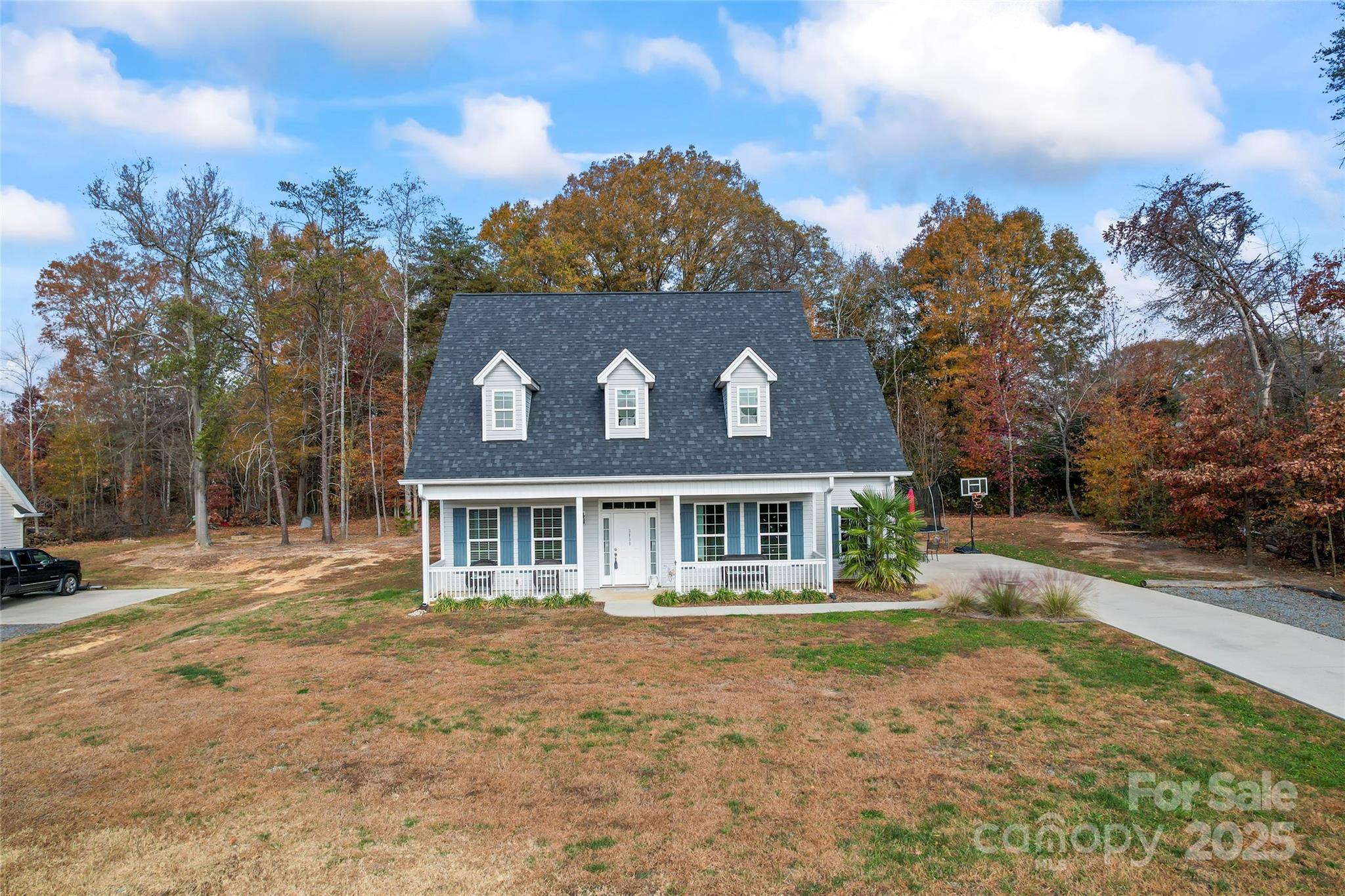 3839 Robinson Circle Gastonia, NC 28056 - Photo 5 of 46 a view of a white house with a big yard and large tree