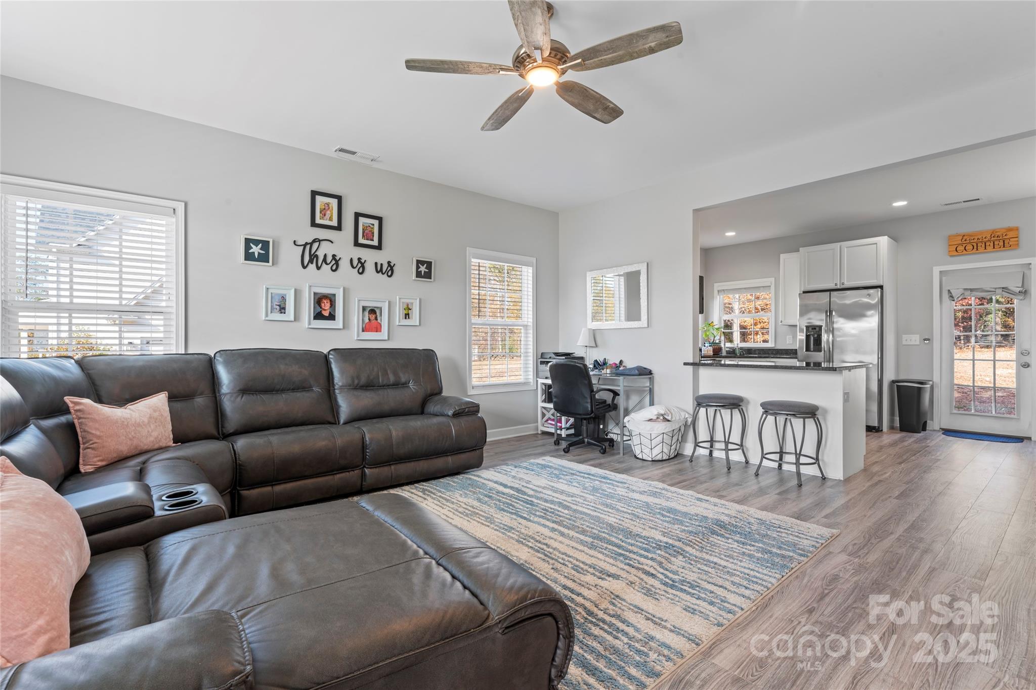 3839 Robinson Circle Gastonia, NC 28056 - Photo 9 of 46 a living room with furniture a ceiling fan and a window