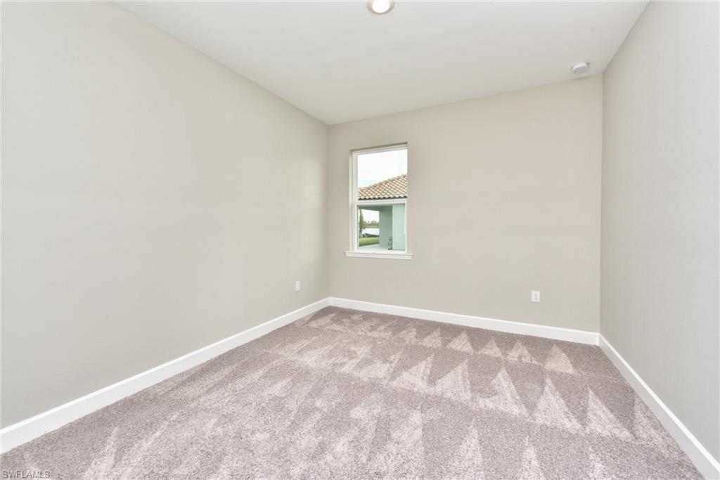 2066 Grove Drive Naples, FL 34120 - Photo 15 of 32 an empty room with a window