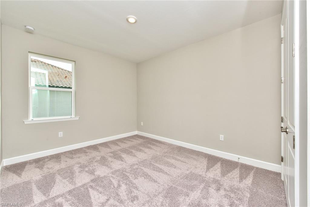 2066 Grove Drive Naples, FL 34120 - Photo 16 of 32 a view of an empty room with a window