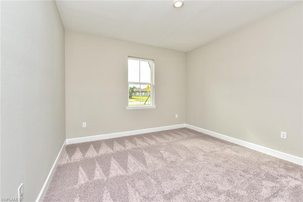 2066 Grove Drive Naples, FL 34120 - Photo 17 of 32 an empty room with a window