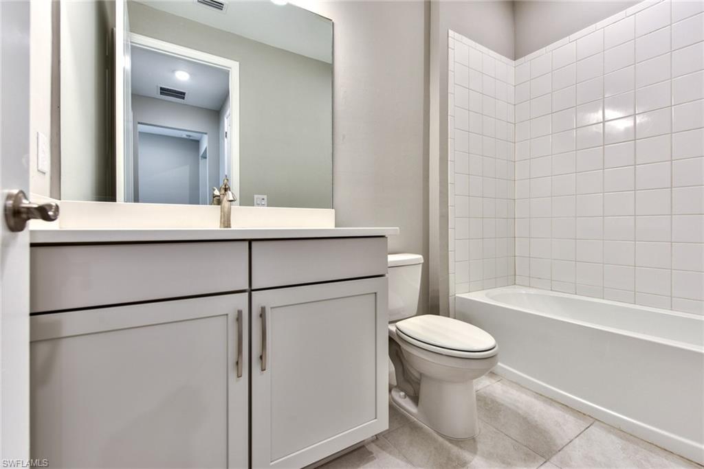 2066 Grove Drive Naples, FL 34120 - Photo 19 of 32 a bathroom with a sink toilet and shower