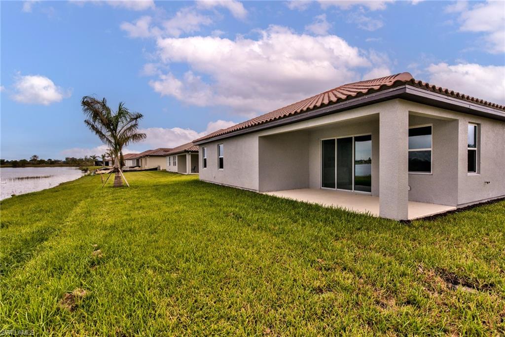 2066 Grove Drive Naples, FL 34120 - Photo 23 of 32 a house view with a garden space