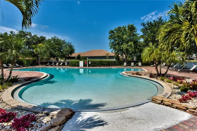 a view of a swimming pool with a yard