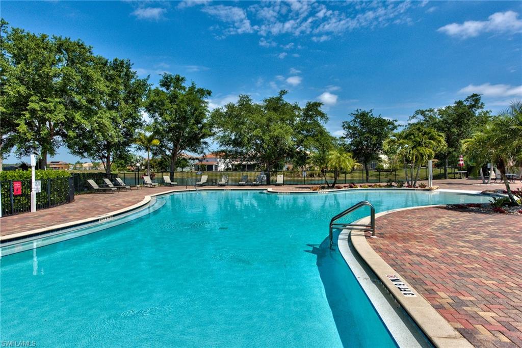 2066 Grove Drive Naples, FL 34120 - Photo 27 of 32 a view of a swimming pool with a yard