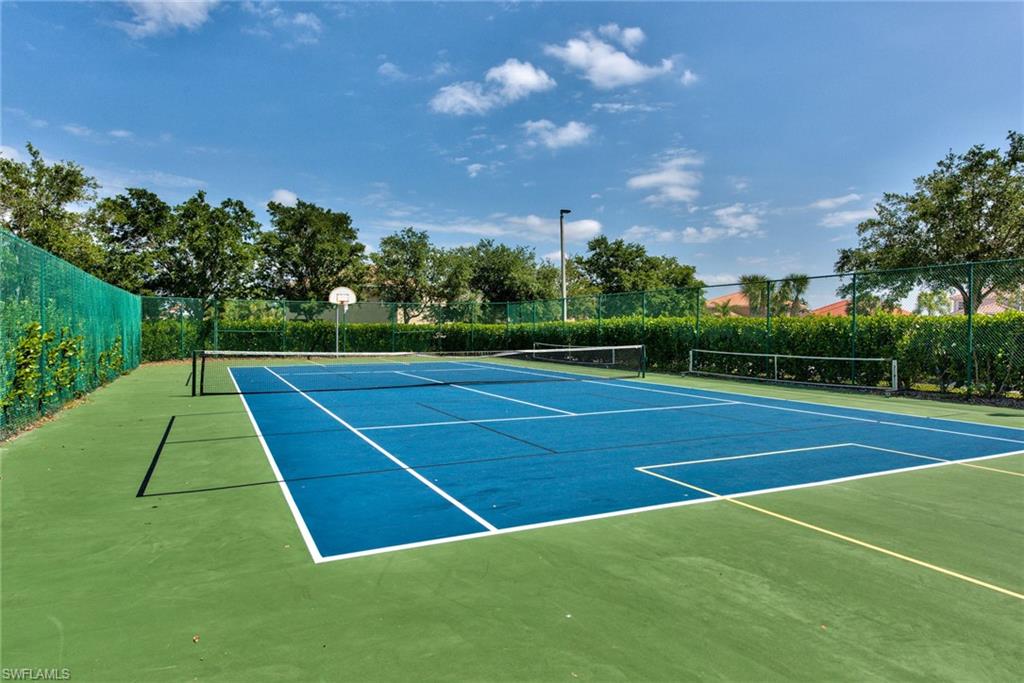 2066 Grove Drive Naples, FL 34120 - Photo 30 of 32 a view of an outdoor space and tennis court