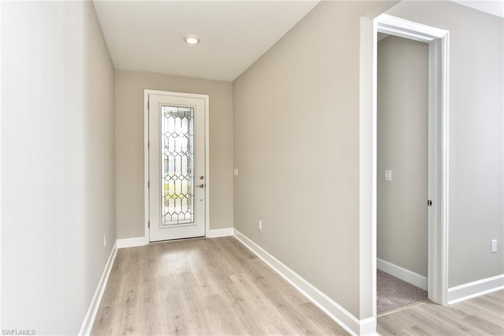 2066 Grove Drive Naples, FL 34120 - Photo 3 of 32 a view of an empty room and window