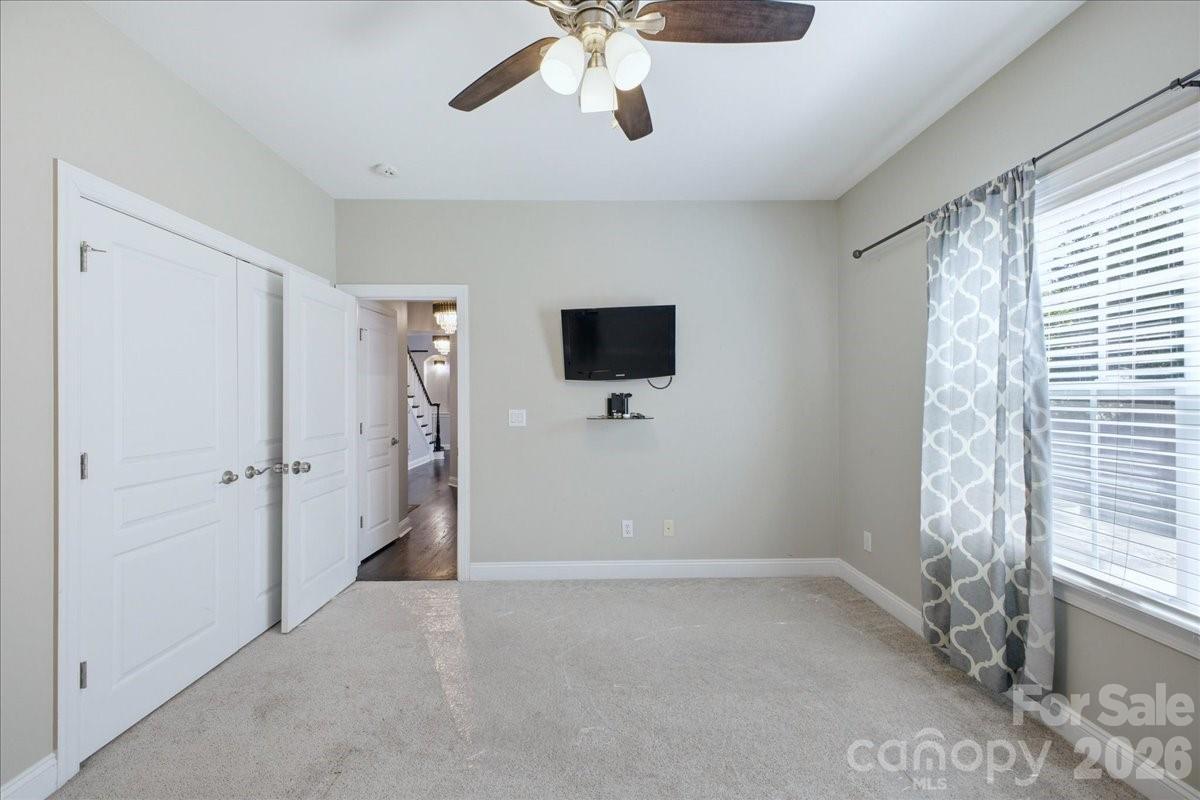 1825 Laveta Road Charlotte, NC 28269 - Photo 26 of 48 a view of a livingroom with a ceiling fan and window