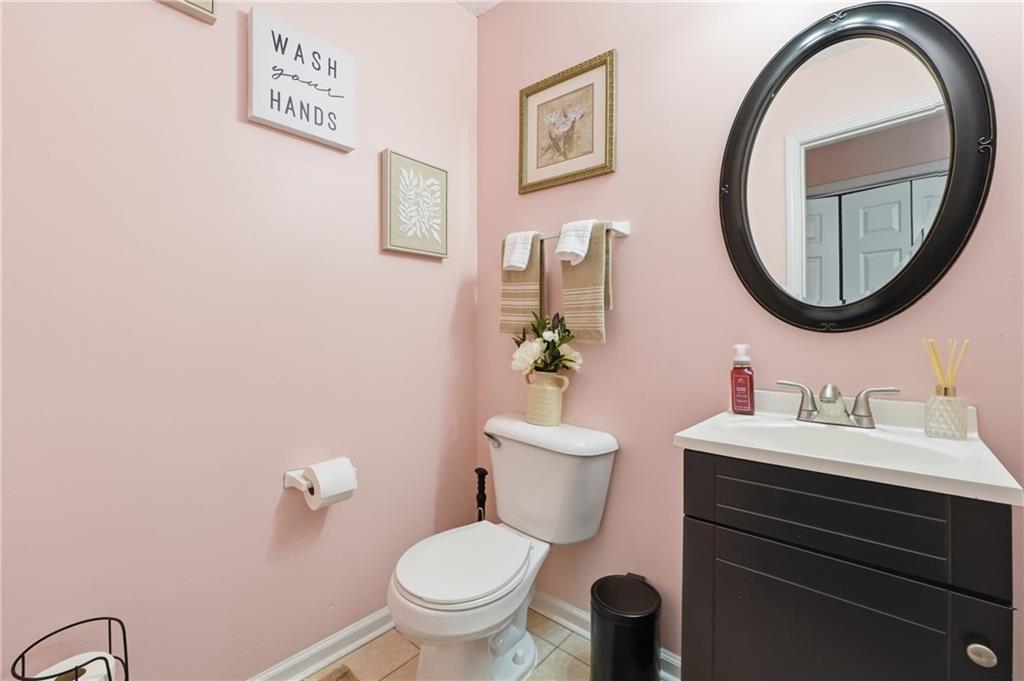 265 Springbottom Drive Southeast Lawrenceville, GA 30046 - Photo 12 of 30 a bathroom with a toilet a sink and a mirror