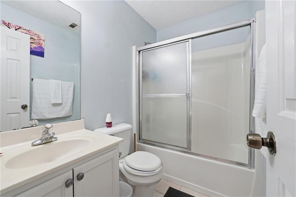 265 Springbottom Drive Southeast Lawrenceville, GA 30046 - Photo 20 of 30 a bathroom with a sink toilet and shower