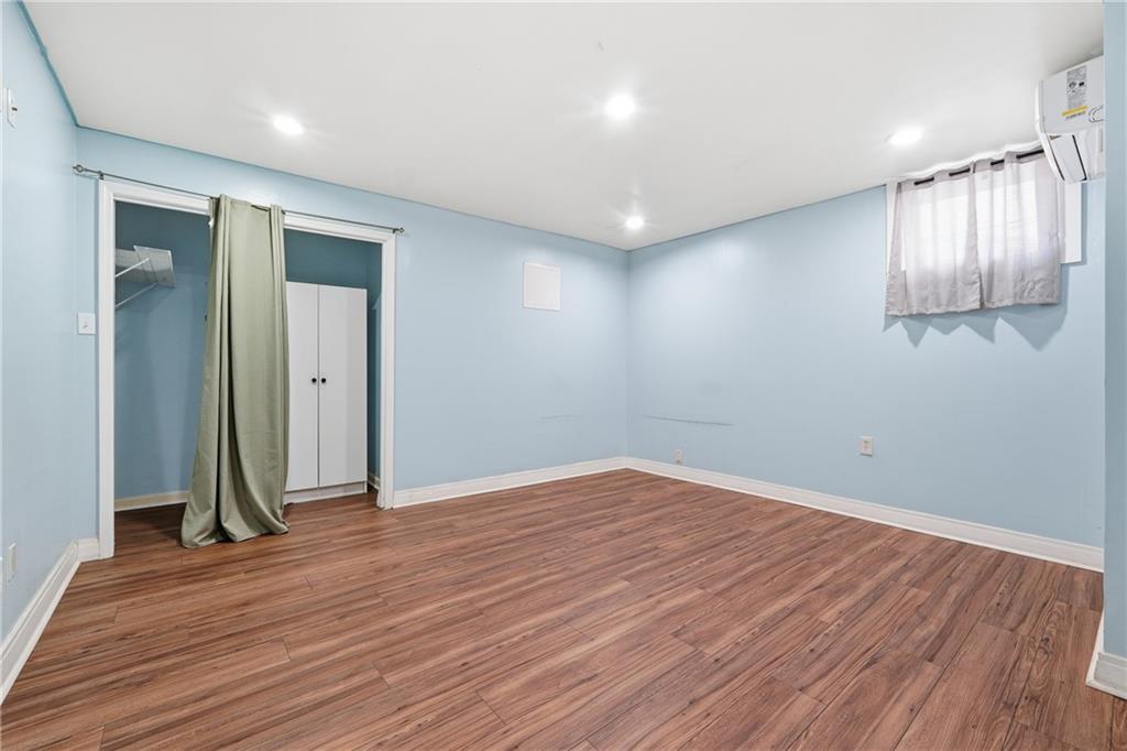 265 Springbottom Drive Southeast Lawrenceville, GA 30046 - Photo 23 of 30 an empty room with wooden floor and a window