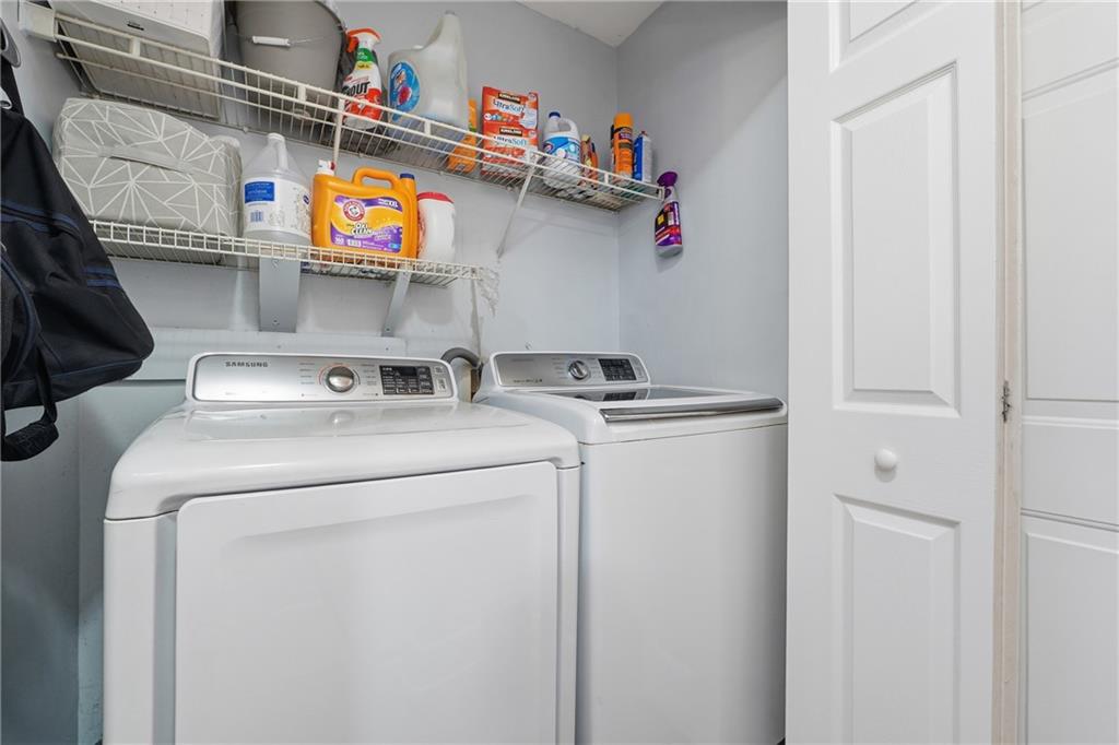 265 Springbottom Drive Southeast Lawrenceville, GA 30046 - Photo 27 of 30 a utility room with dryer and washer