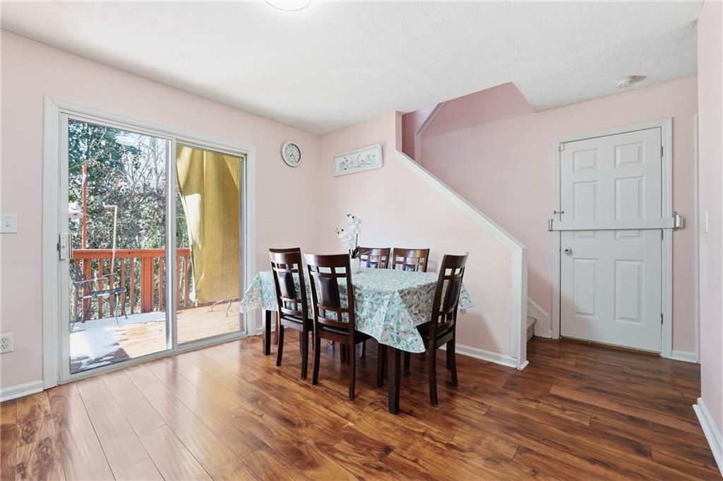 265 Springbottom Drive Southeast Lawrenceville, GA 30046 - Photo 6 of 30 a dining room with furniture and wooden floor