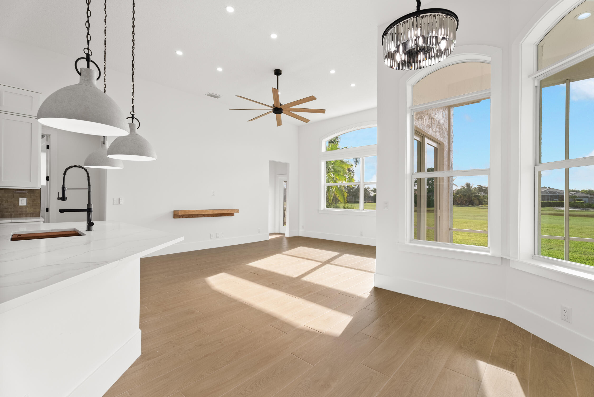 2218 Southeast Stonehaven Road Port St. Lucie, FL 34952 - Photo 13 of 48 a view of a room with a chandelier and living room view