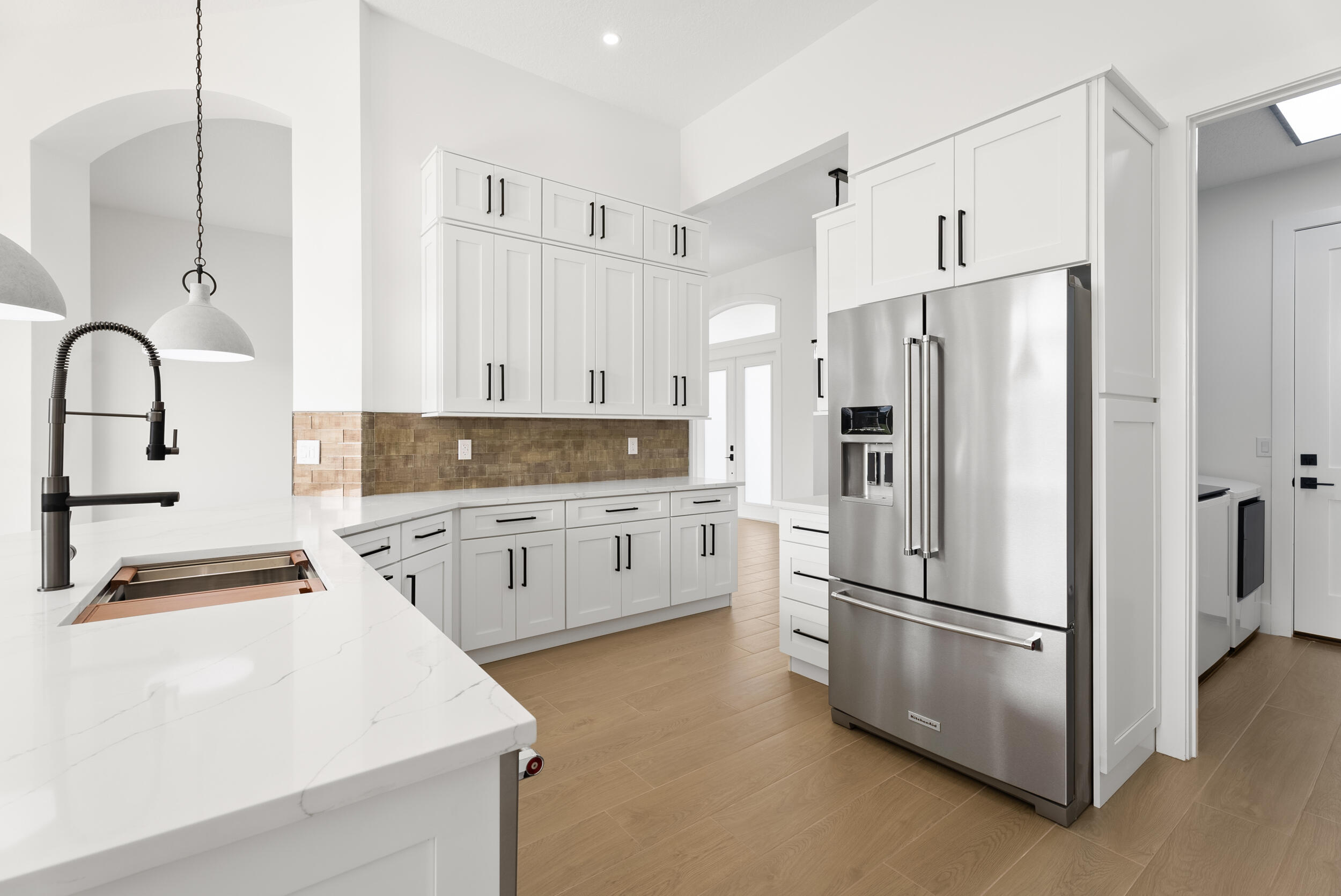 2218 Southeast Stonehaven Road Port St. Lucie, FL 34952 - Photo 17 of 48 a kitchen with stainless steel appliances a refrigerator sink and stove