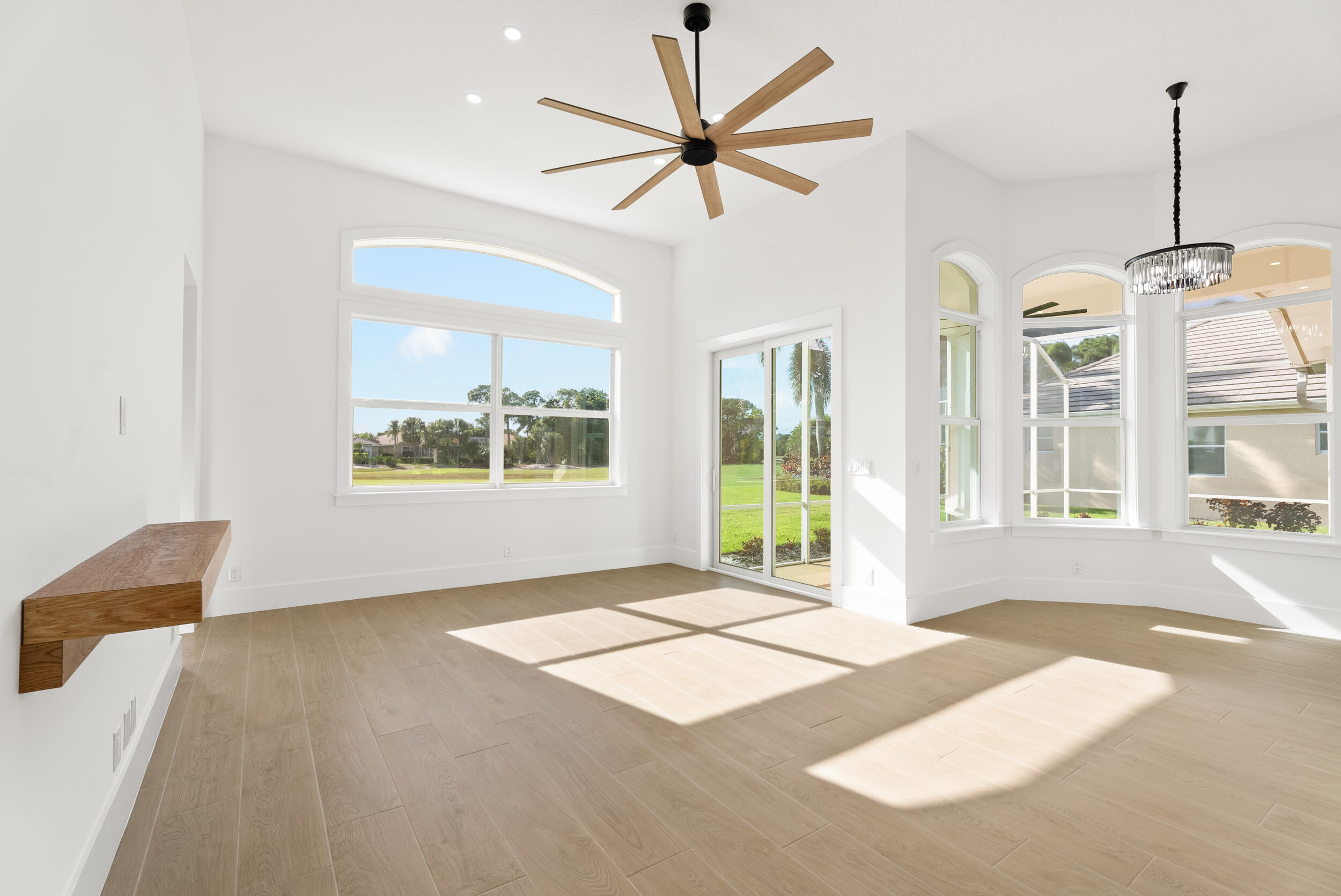 2218 Southeast Stonehaven Road Port St. Lucie, FL 34952 - Photo 22 of 48 a view of an empty room with a window and kitchen view