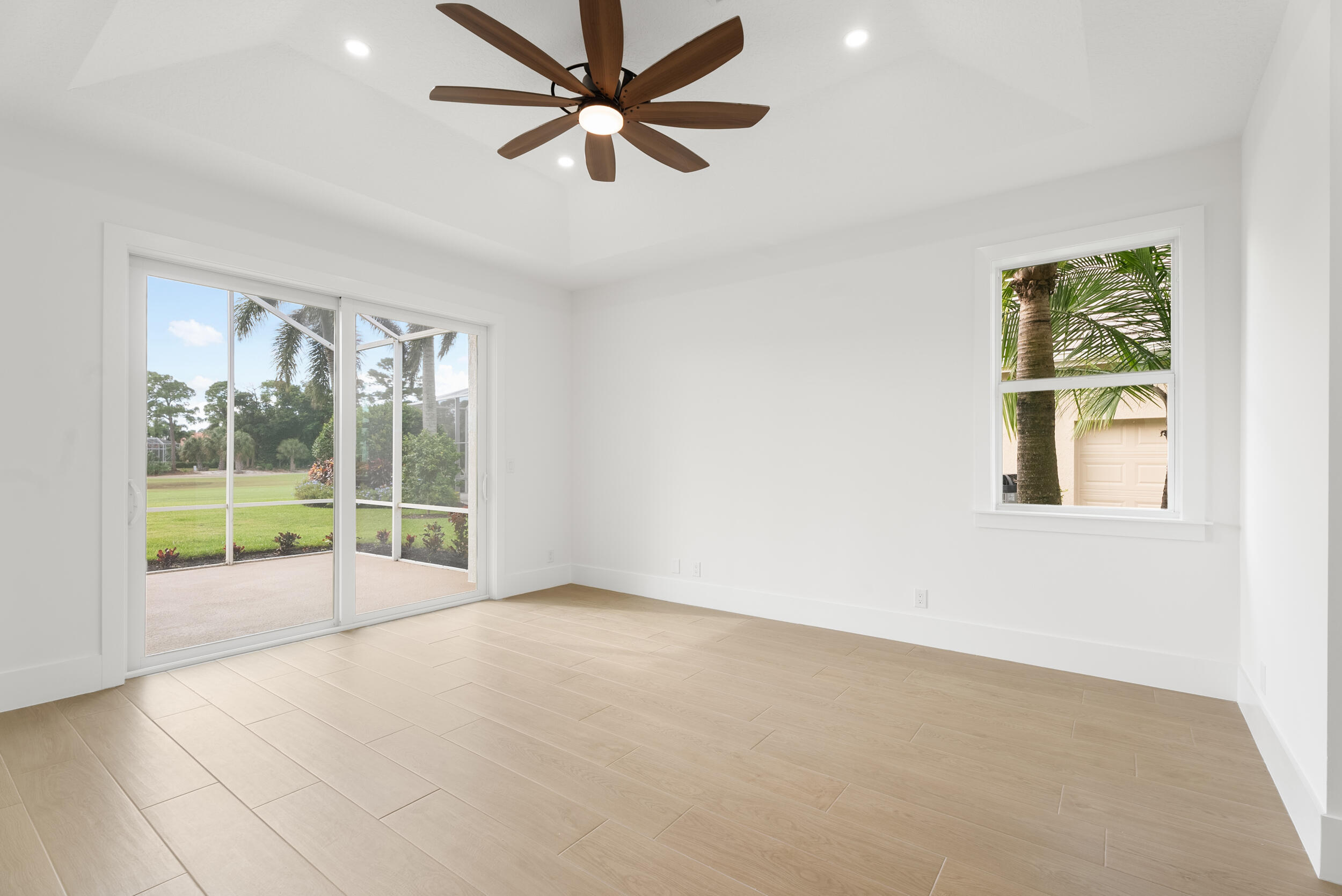 2218 Southeast Stonehaven Road Port St. Lucie, FL 34952 - Photo 23 of 48 an empty room with windows and fan