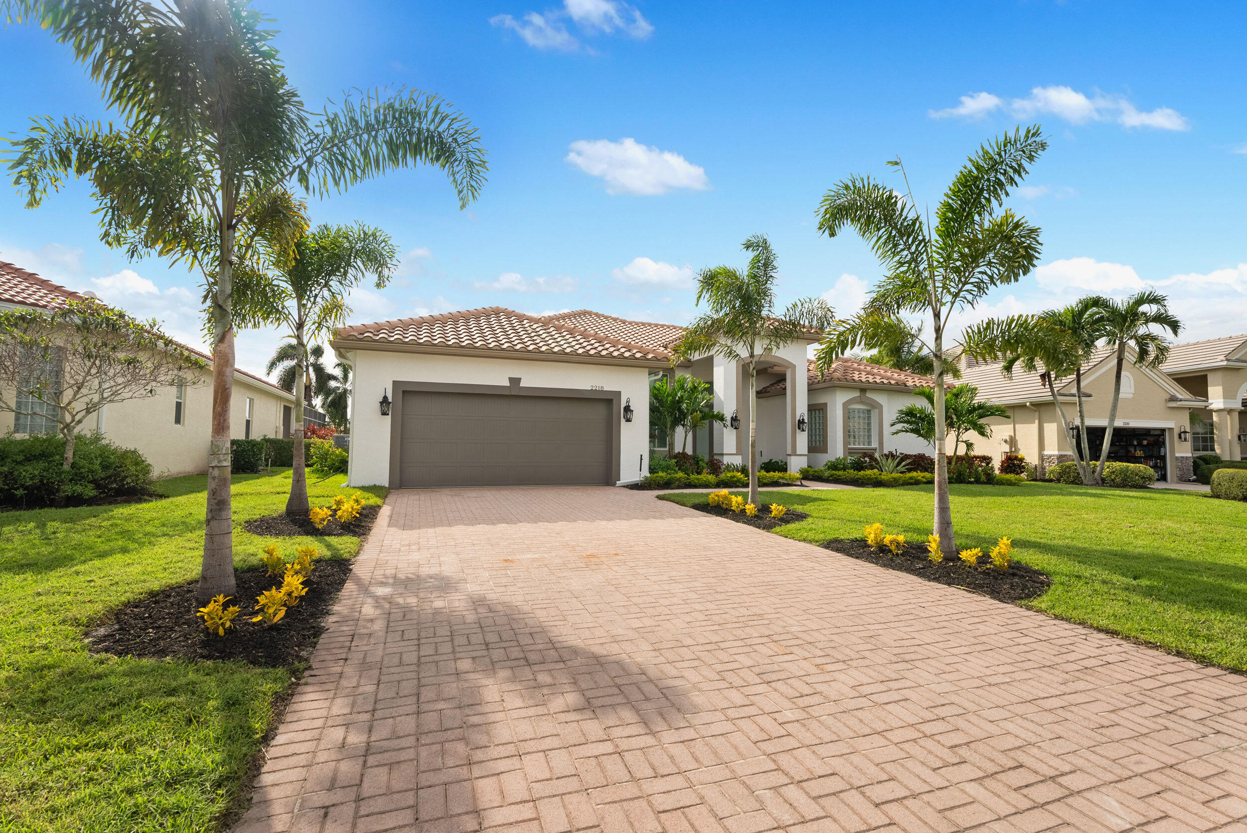 2218 Southeast Stonehaven Road Port St. Lucie, FL 34952 - Photo 3 of 48 a view of an house with backyard and a tree
