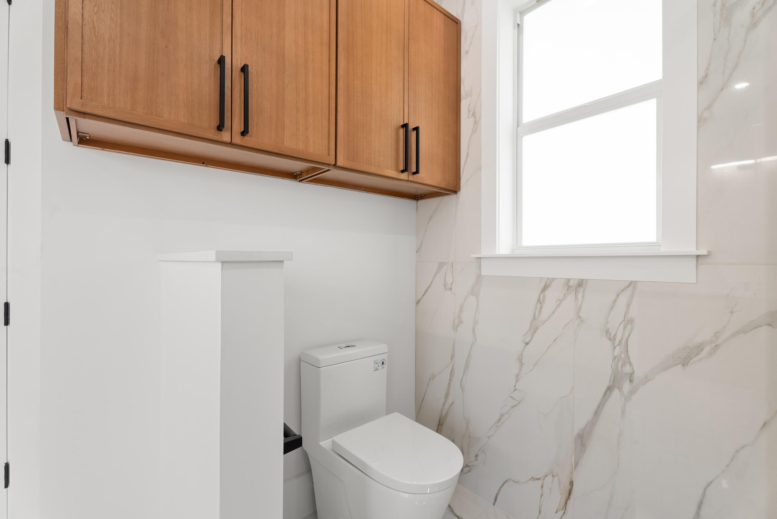 2218 Southeast Stonehaven Road Port St. Lucie, FL 34952 - Photo 31 of 48 a bathroom with a toilet sink and window