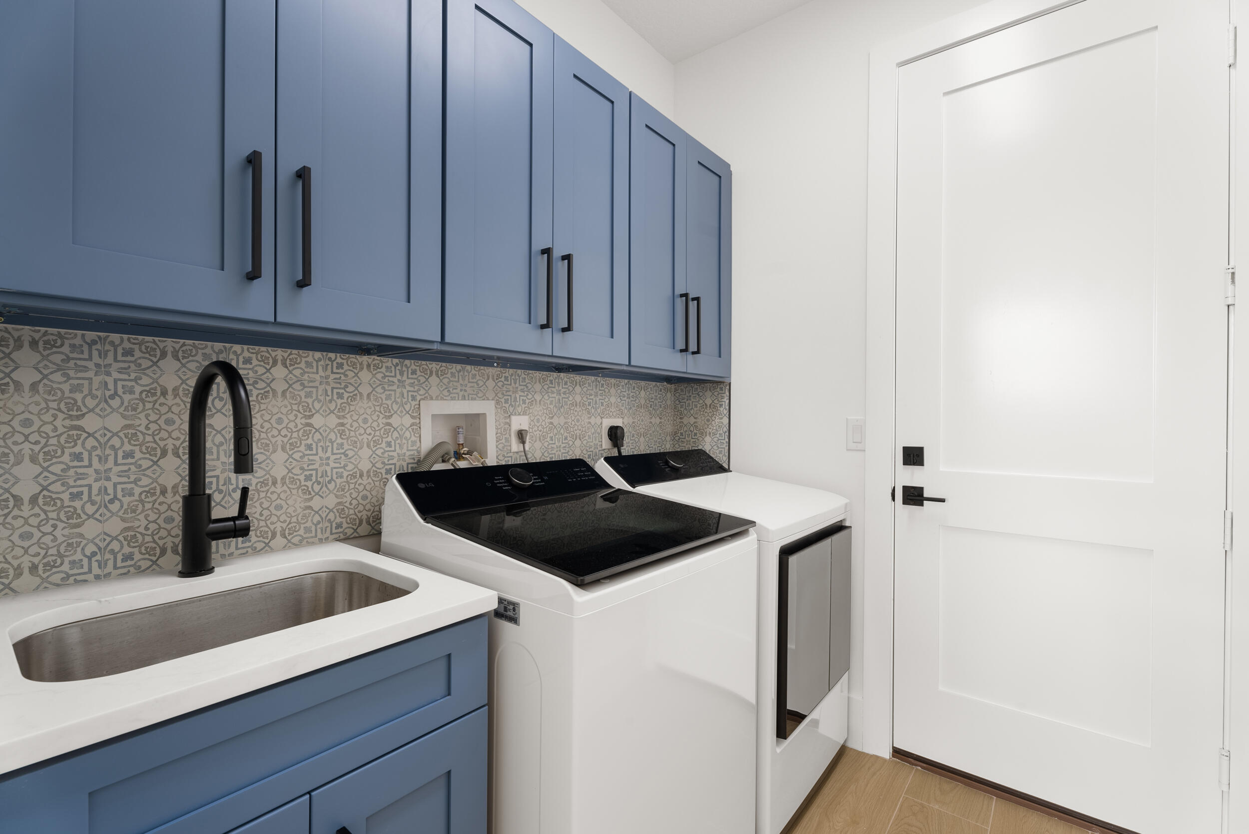 2218 Southeast Stonehaven Road Port St. Lucie, FL 34952 - Photo 32 of 48 a kitchen with a sink and cabinets