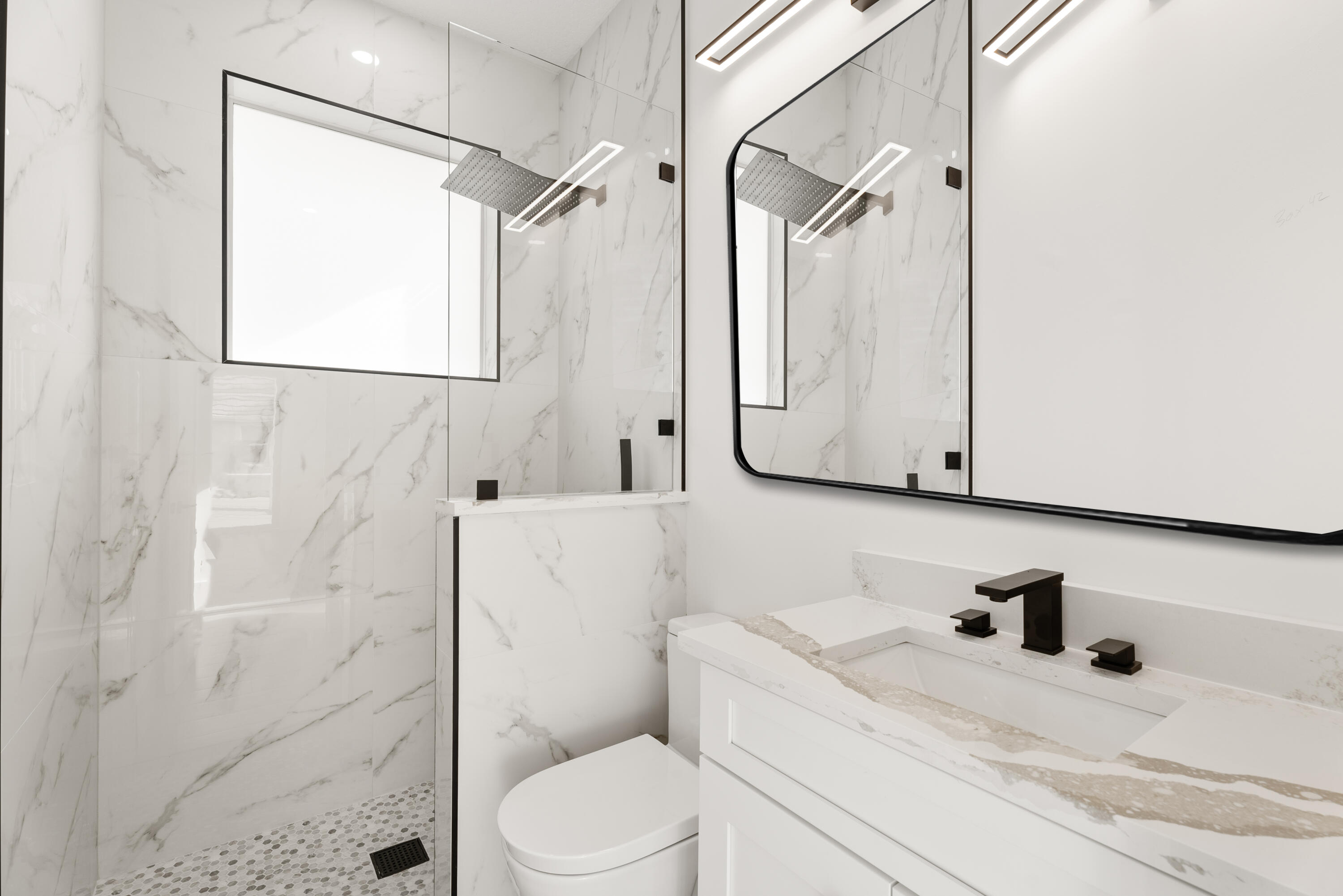 2218 Southeast Stonehaven Road Port St. Lucie, FL 34952 - Photo 33 of 48 a bathroom with a sink toilet and shower