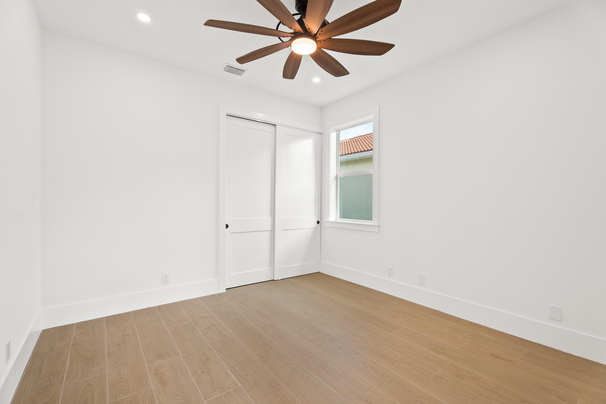 2218 Southeast Stonehaven Road Port St. Lucie, FL 34952 - Photo 34 of 48 a view of a room with window and ceiling fan