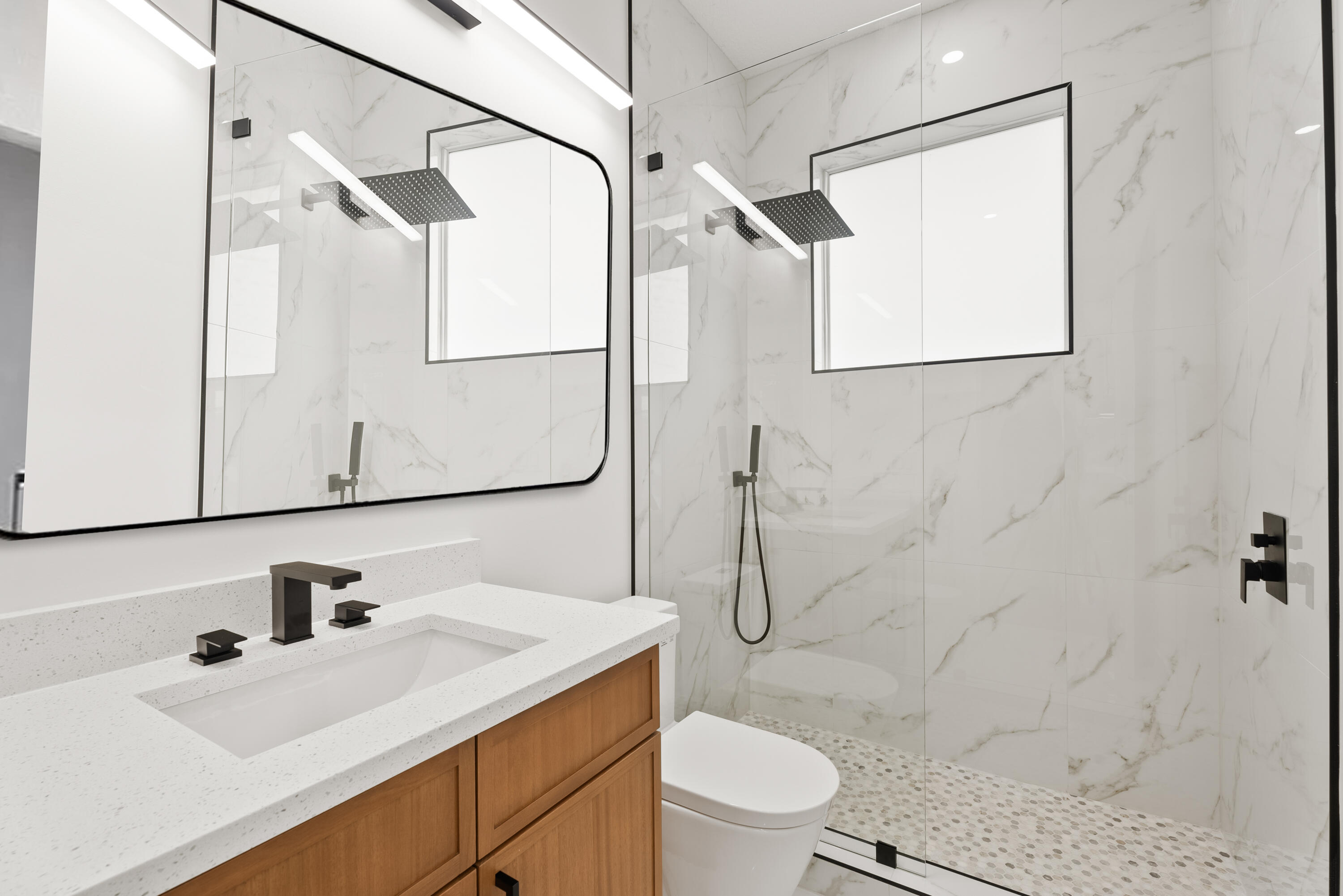 2218 Southeast Stonehaven Road Port St. Lucie, FL 34952 - Photo 37 of 48 a bathroom with a sink toilet and shower