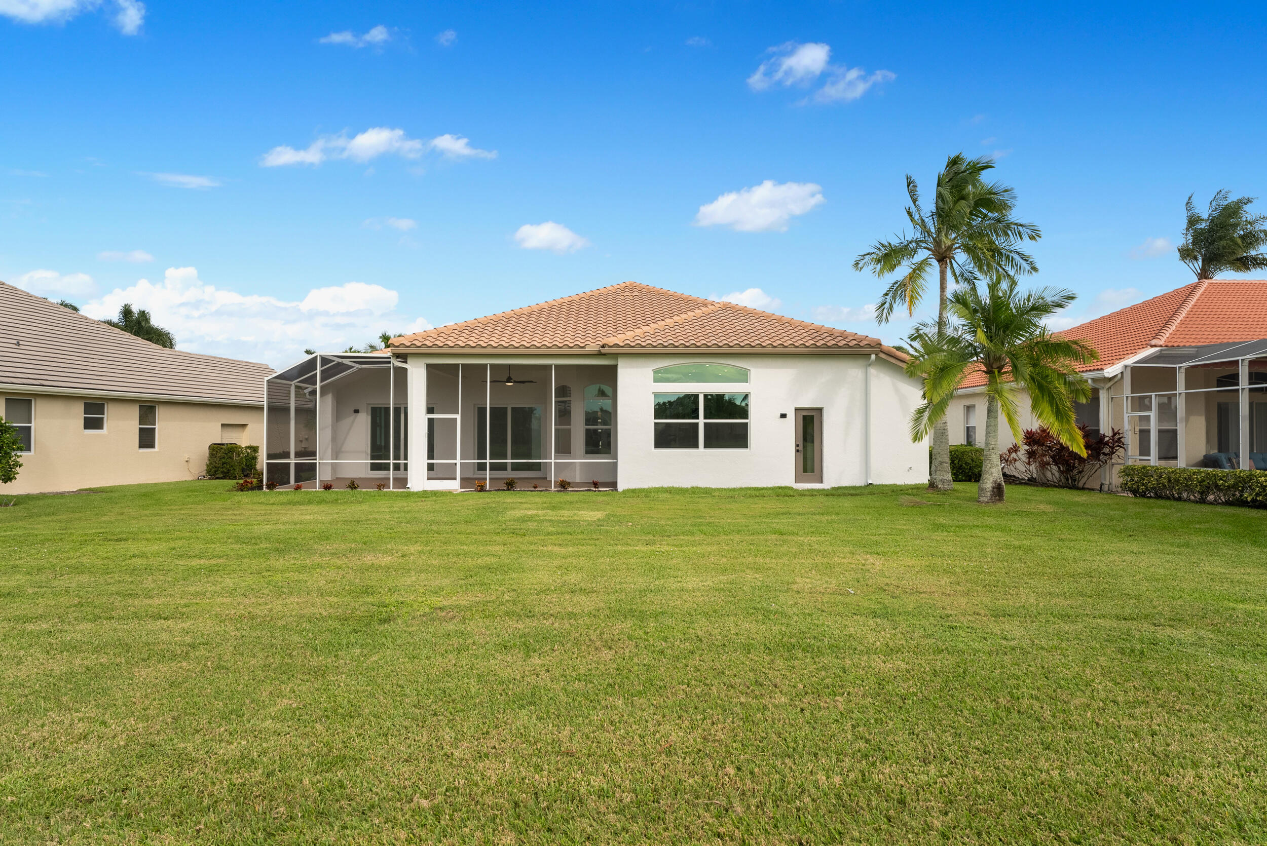 2218 Southeast Stonehaven Road Port St. Lucie, FL 34952 - Photo 42 of 48 a front view of a house with a garden