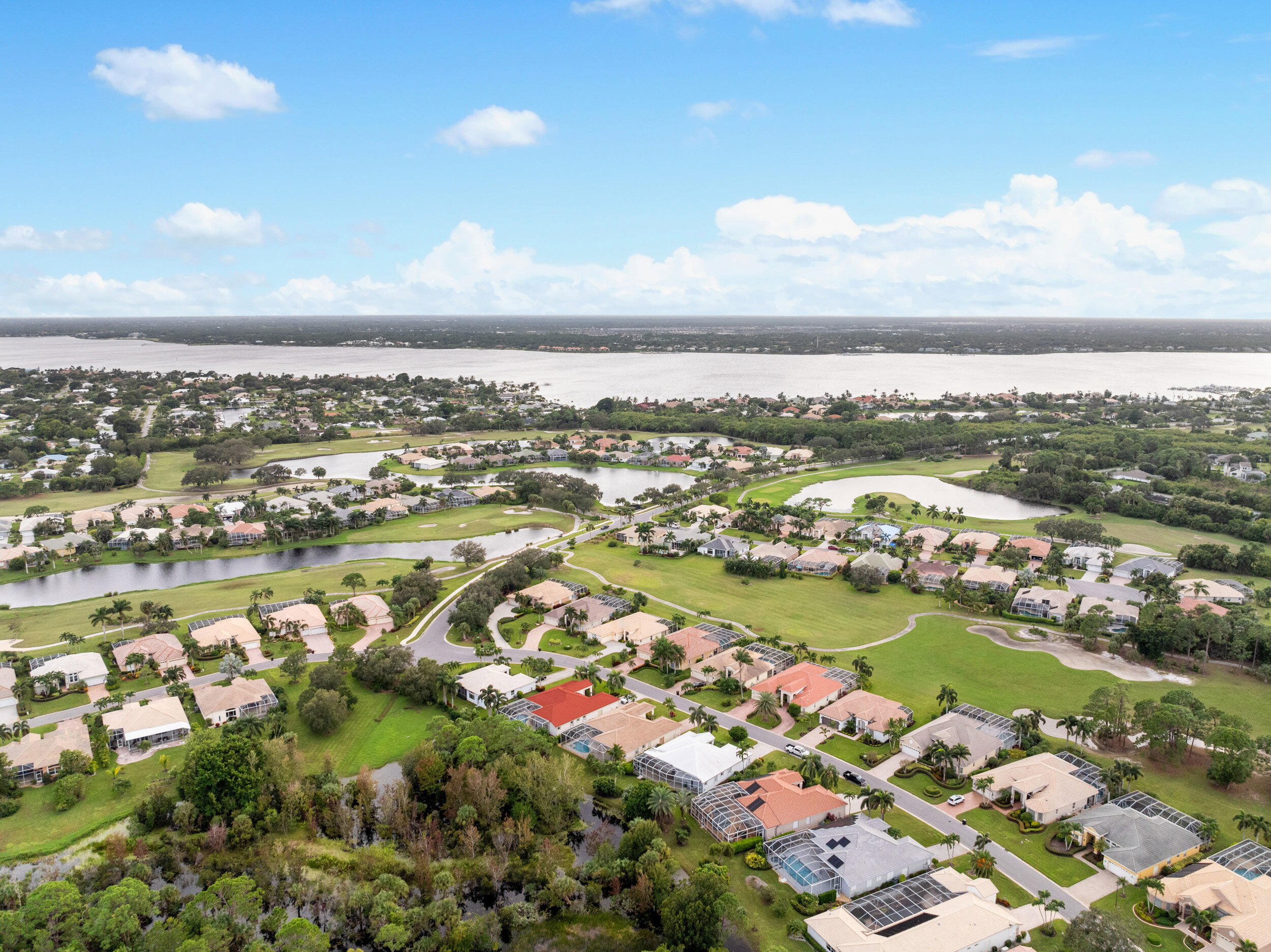 2218 Southeast Stonehaven Road Port St. Lucie, FL 34952 - Photo 47 of 48 an aerial view of city and lake