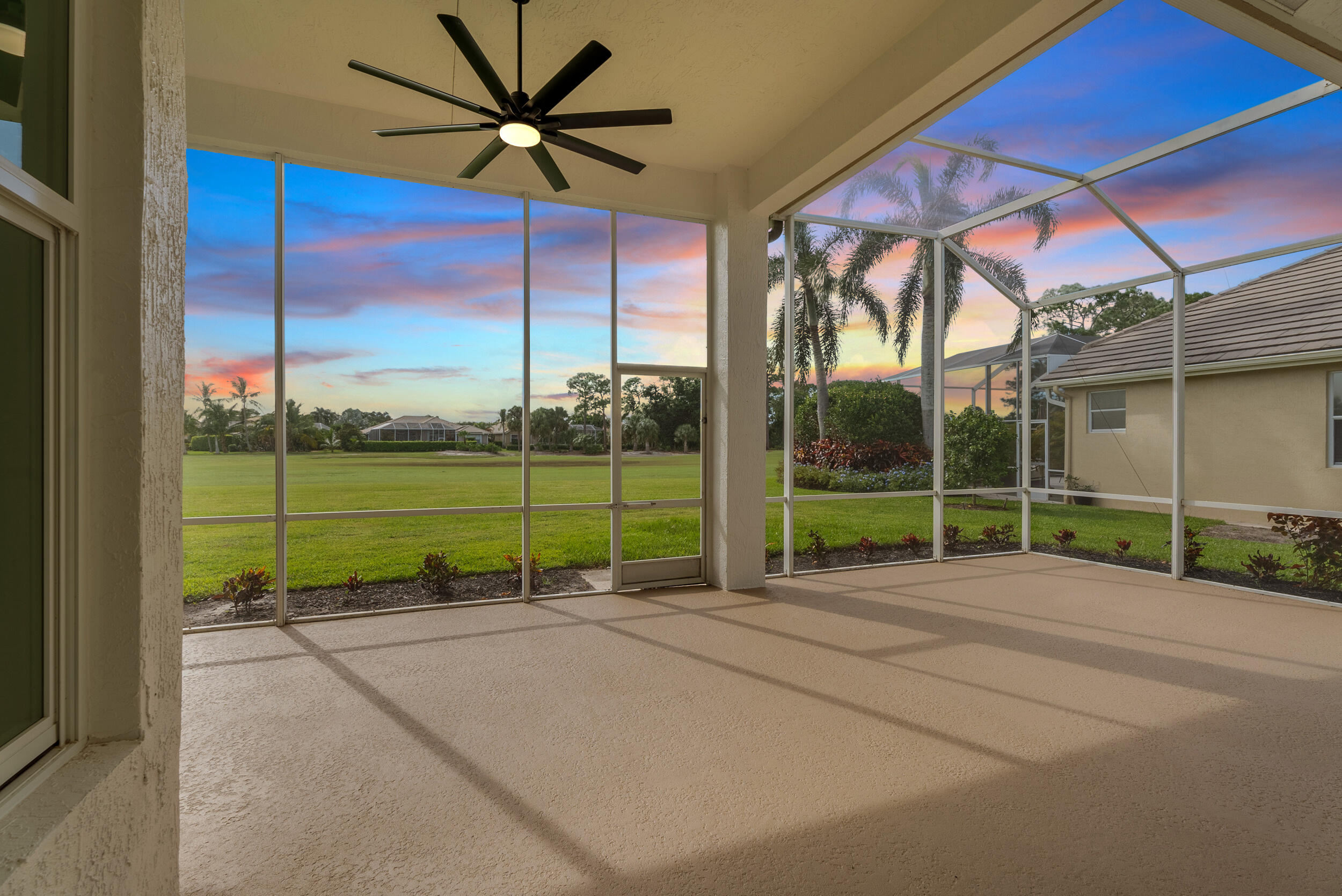 2218 Southeast Stonehaven Road Port St. Lucie, FL 34952 - Photo 5 of 48 a view of a house with a backyard and porch