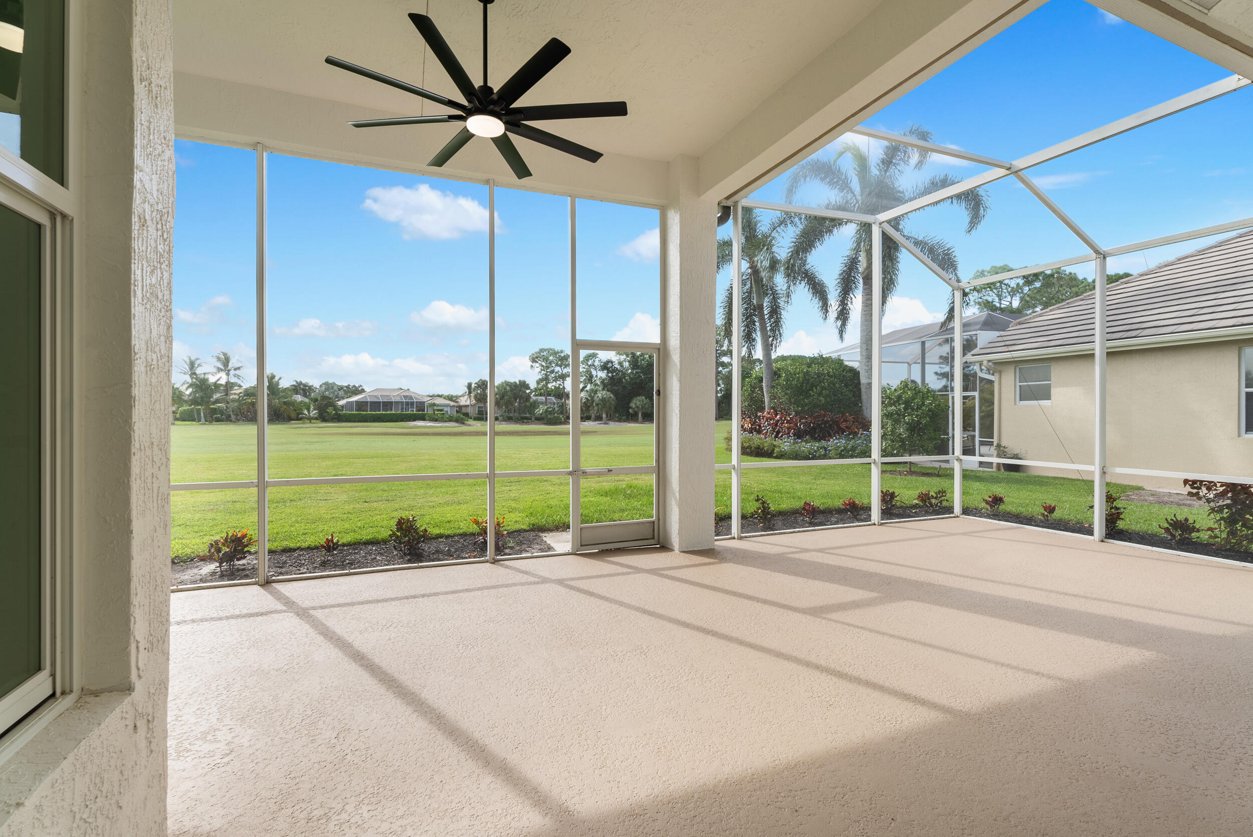 2218 Southeast Stonehaven Road Port St. Lucie, FL 34952 - Photo 6 of 48 a view of a house with a backyard and a garage