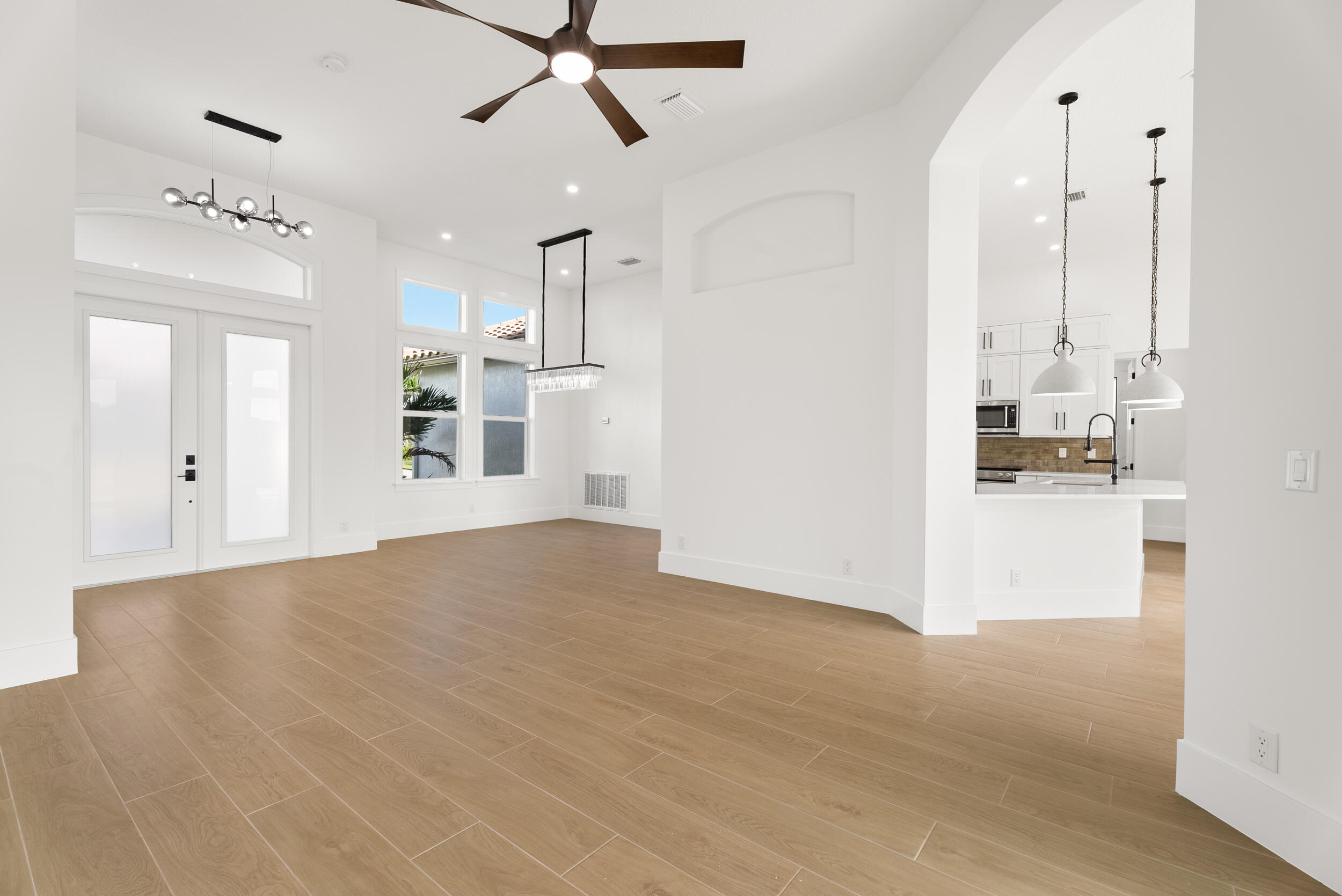 2218 Southeast Stonehaven Road Port St. Lucie, FL 34952 - Photo 9 of 48 a view of a kitchen with wooden floor