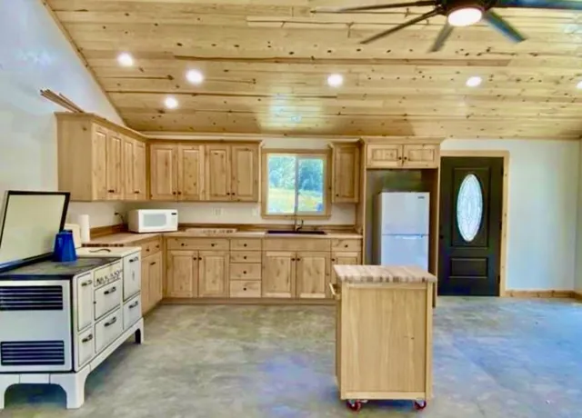 a close view of a stove with granite countertop