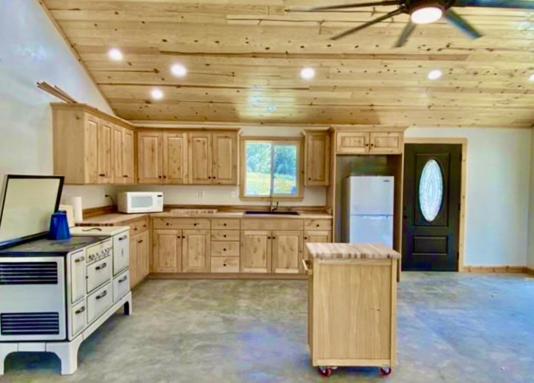 20505 Coalinga Road Paicines, CA 95043 - Photo 12 of 29 a kitchen with sink cabinets and window