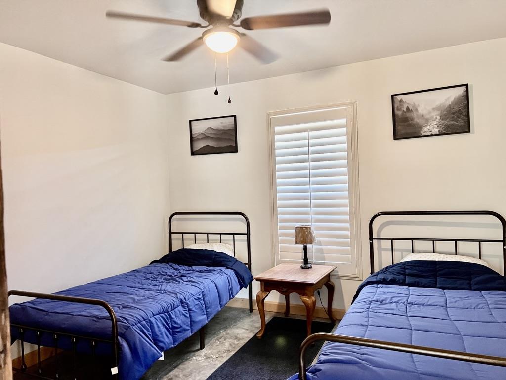 20505 Coalinga Road Paicines, CA 95043 - Photo 16 of 29 a bedroom with a bed and a potted plant