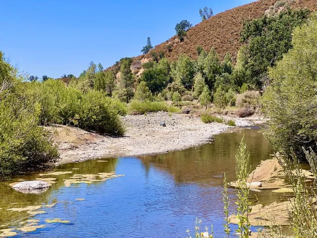 a view of a swimming pool with an outdoor space and seating area