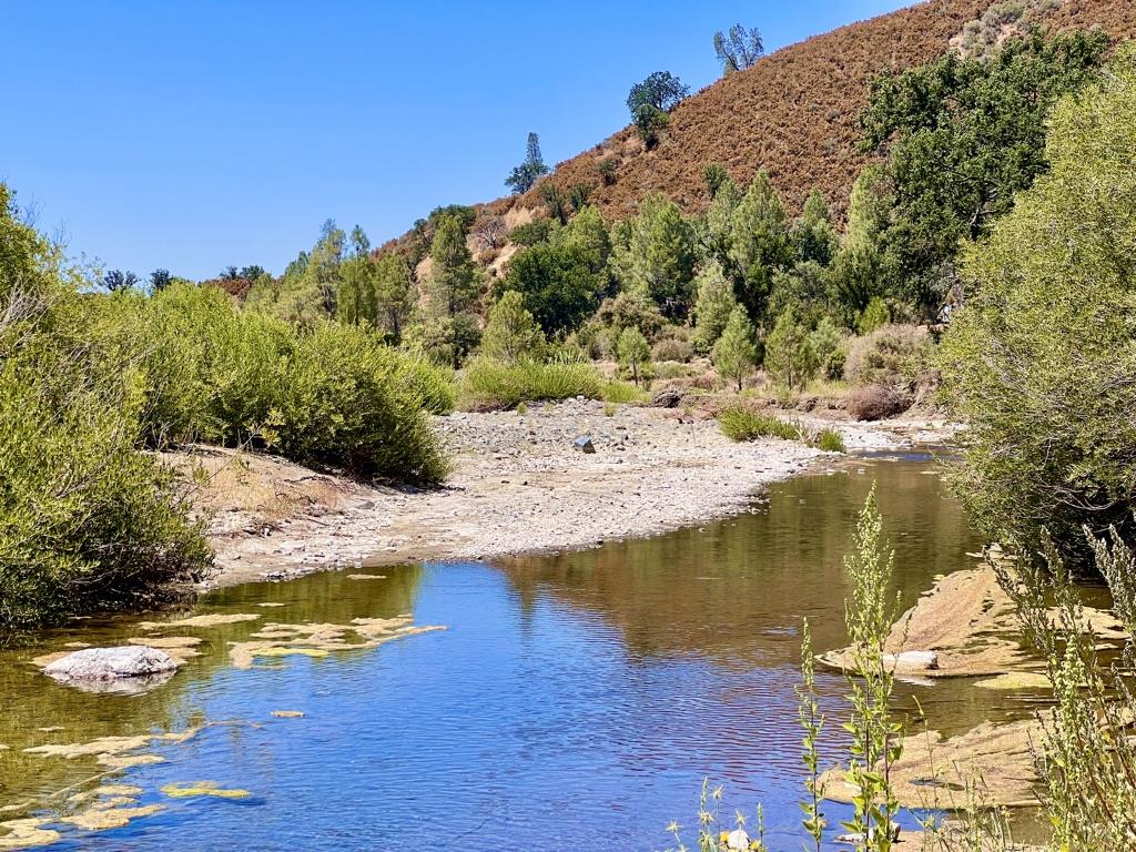 20505 Coalinga Road Paicines, CA 95043 - Photo 3 of 29 a view of a swimming pool with an outdoor space and seating area