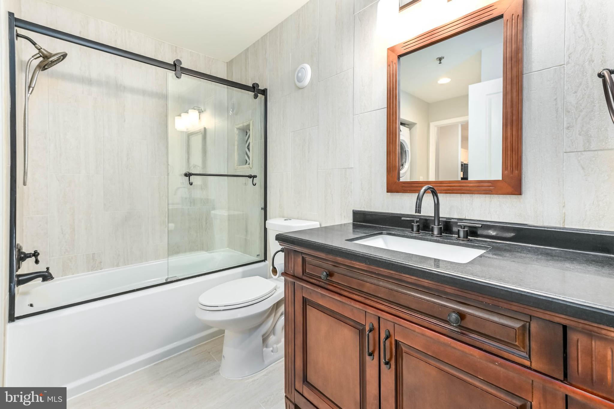 5573 Seminary Road, Unit 115 Falls Church, VA 22041 - Photo 14 of 32 Updated bathroom with warm finishes.