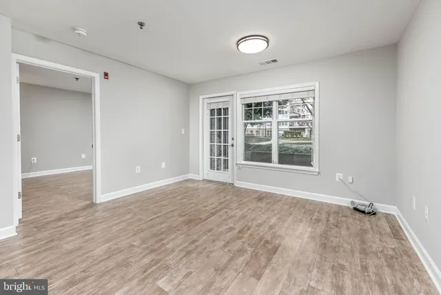 a kitchen with refrigerator and stove