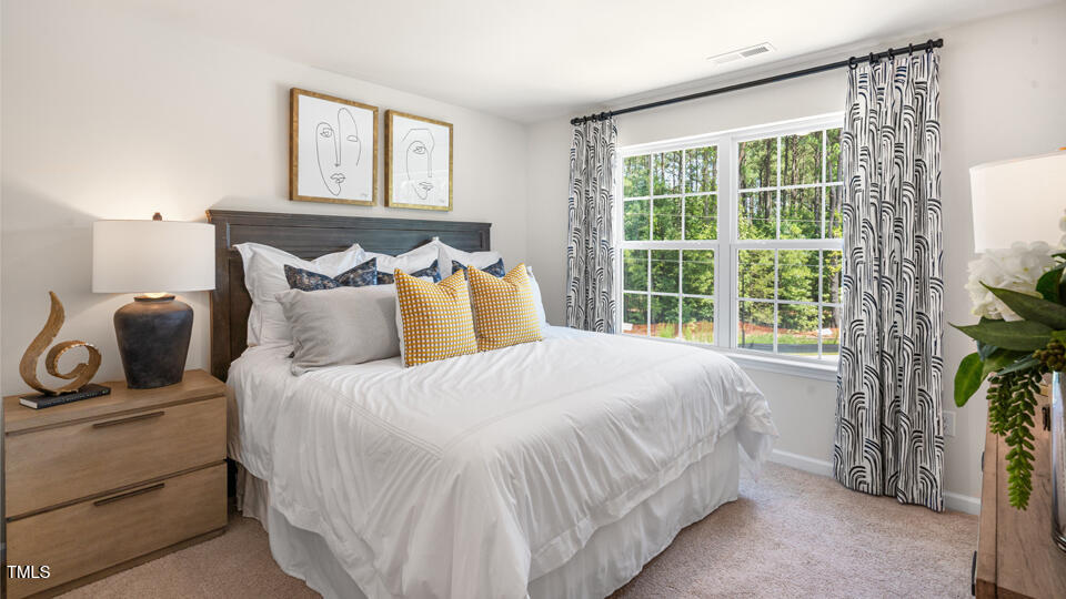 8505 Beckett Chase Way Raleigh, NC 27616 - Photo 14 of 30 a bedroom with a bed and a window