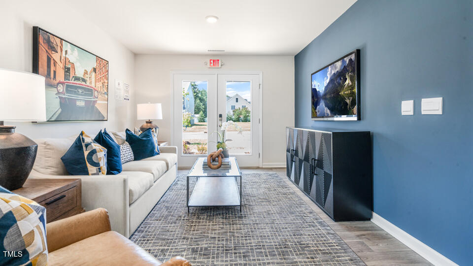 8505 Beckett Chase Way Raleigh, NC 27616 - Photo 10 of 30 a living room with furniture and a rug