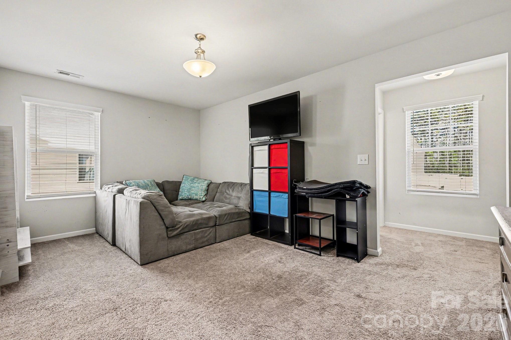 1158 Whitehall Hill Road York, SC 29745 - Photo 12 of 27 a living room with furniture and a flat screen tv