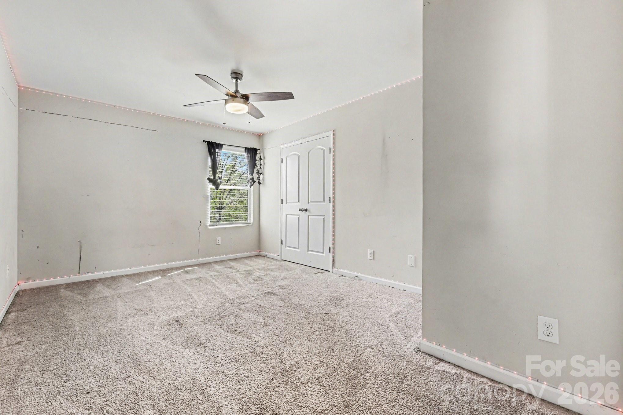 1158 Whitehall Hill Road York, SC 29745 - Photo 14 of 27 an empty room with fan and windows