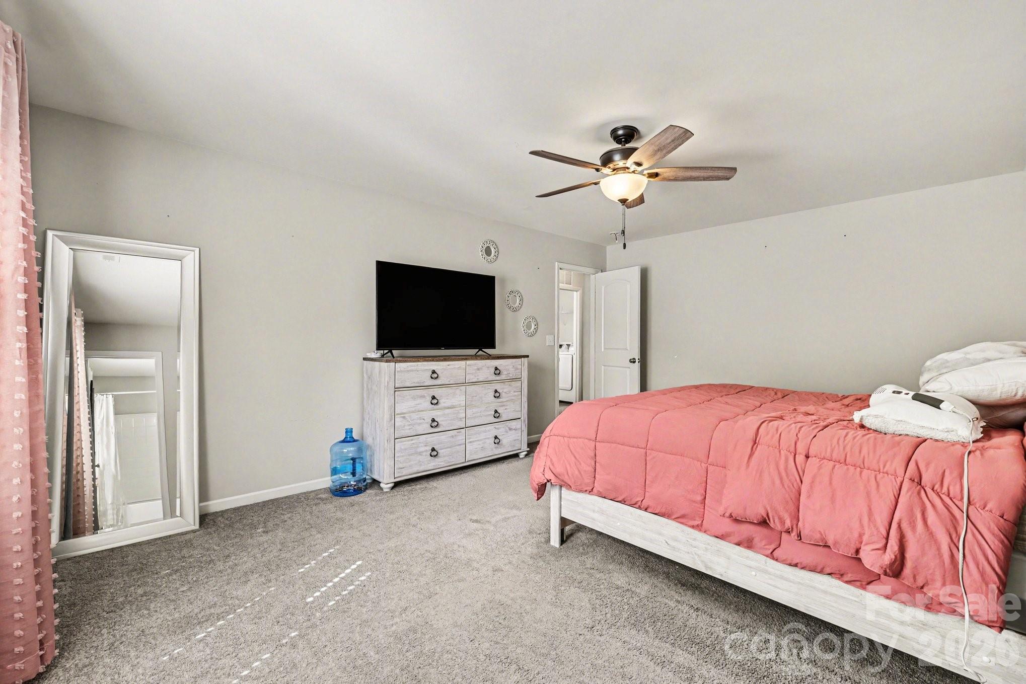 1158 Whitehall Hill Road York, SC 29745 - Photo 19 of 27 a bedroom with a bed and a flat tv screen on dresser