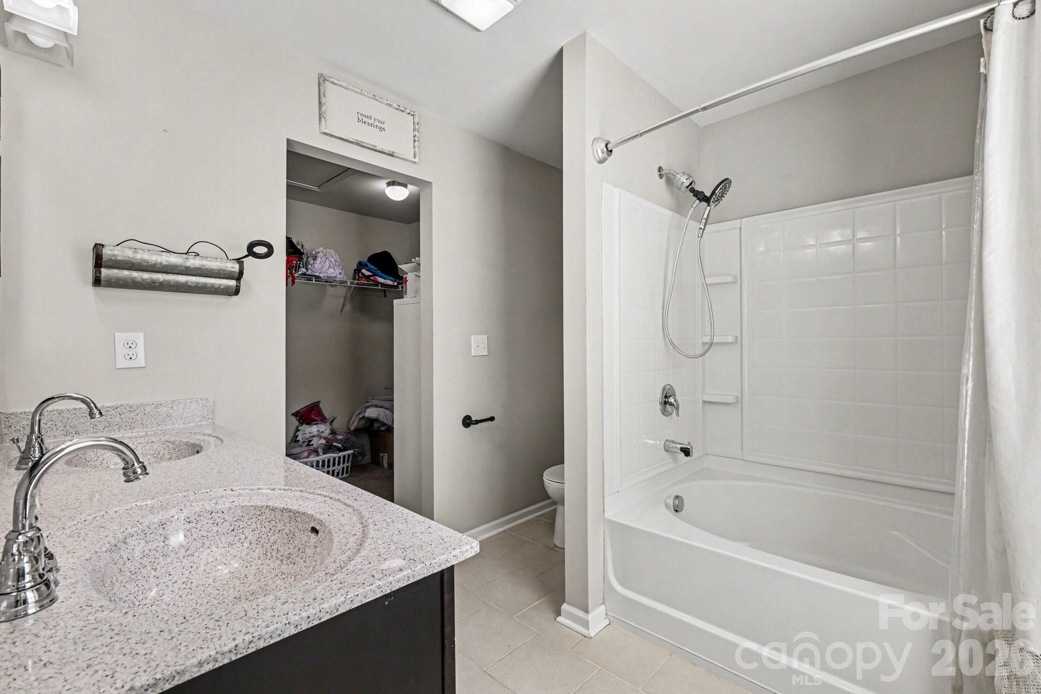1158 Whitehall Hill Road York, SC 29745 - Photo 20 of 27 a bathroom with a tub sink vanity and mirror