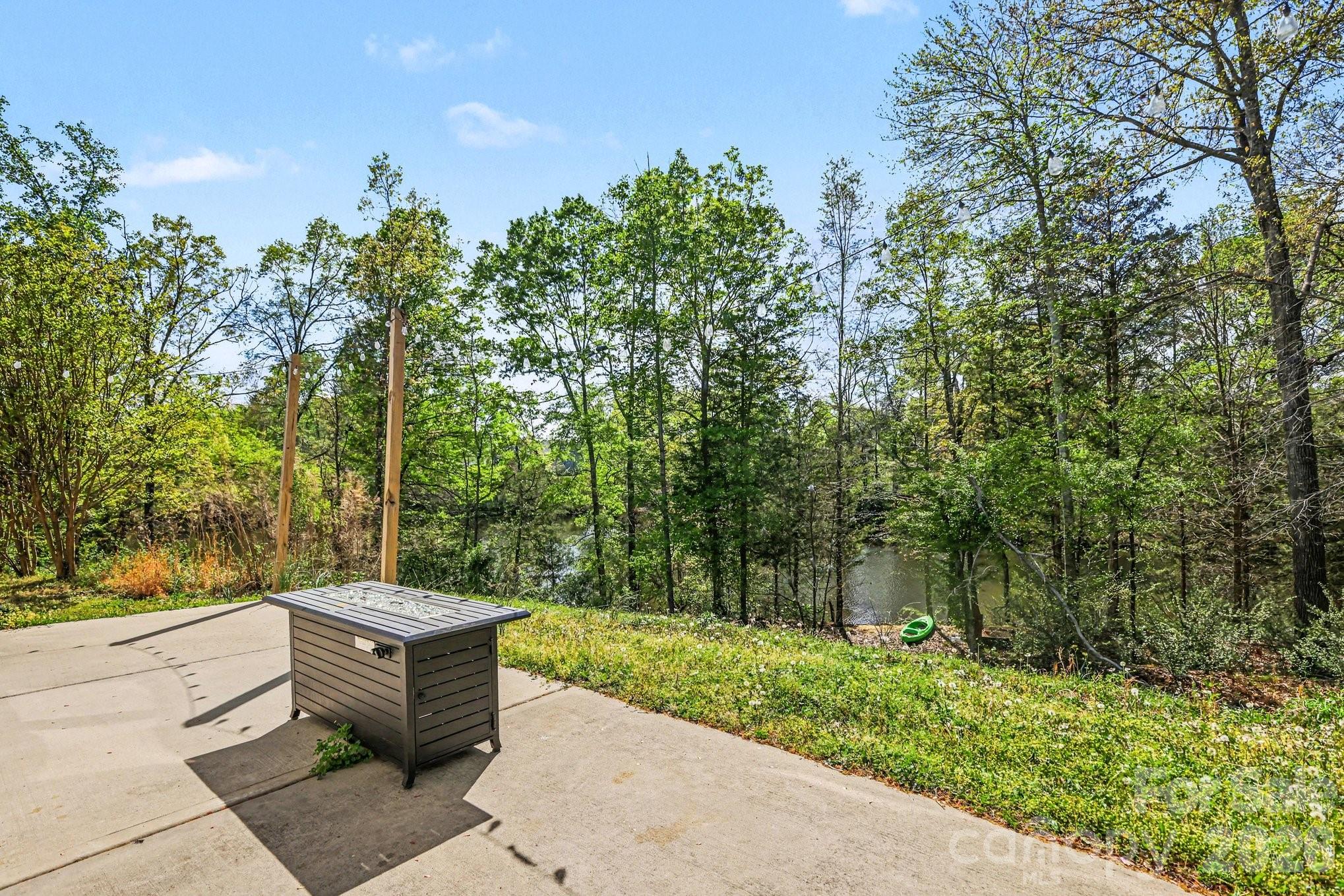 1158 Whitehall Hill Road York, SC 29745 - Photo 26 of 27 a view of a bathtub and trees in the background