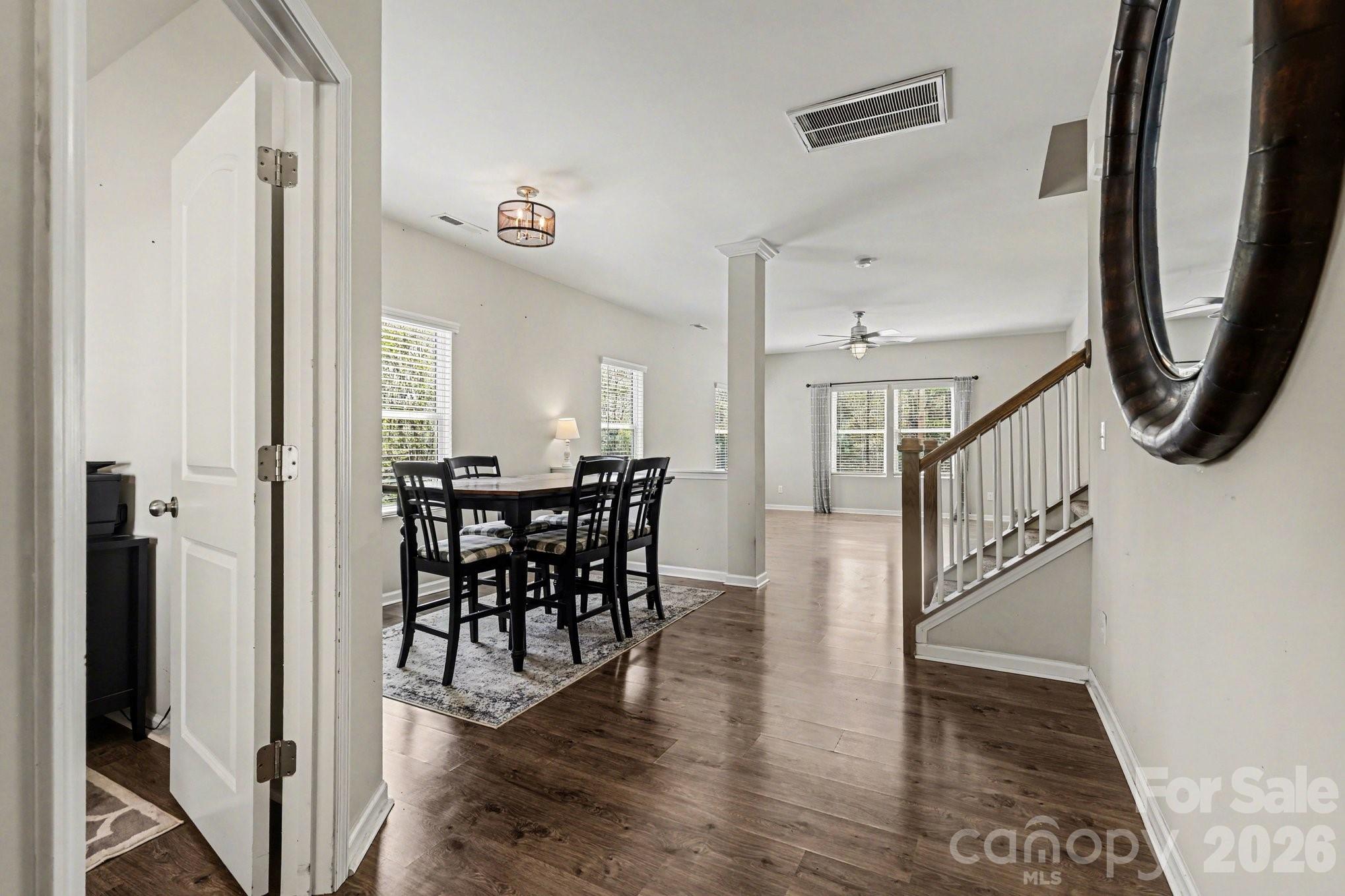 1158 Whitehall Hill Road York, SC 29745 - Photo 7 of 27 a view of a hallway with dining area wooden floor and a rug