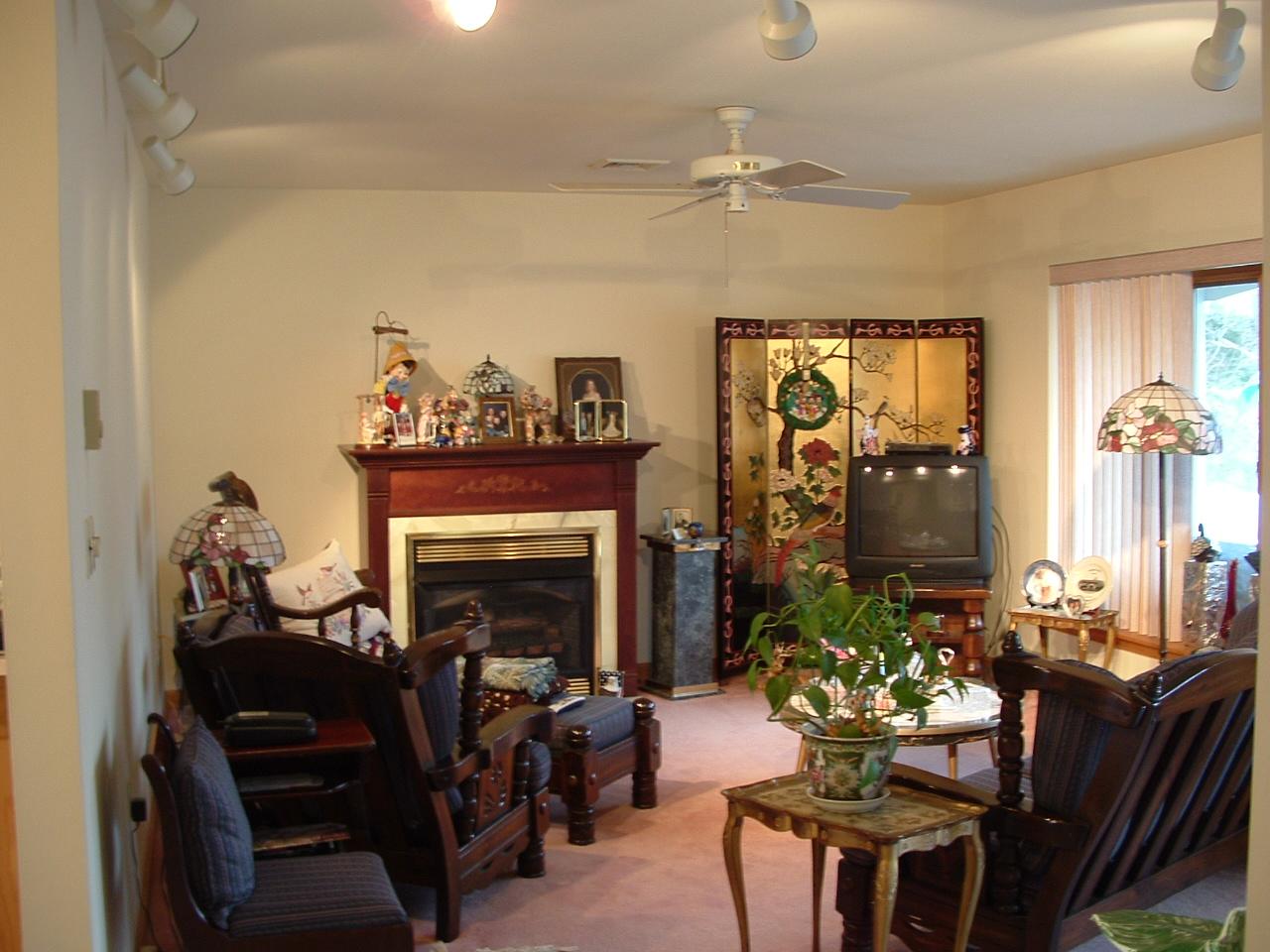 18 Cedar Road Mount Pocono, PA 18344 - Photo 6 of 8 a living room with furniture a chandelier and a fireplace