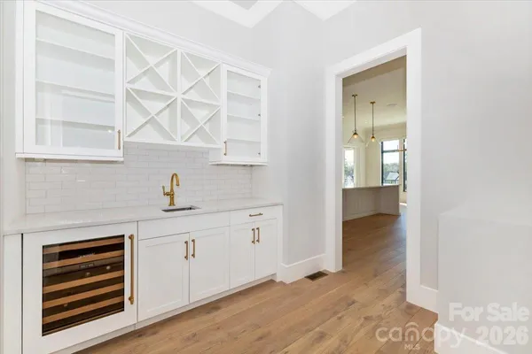 a room with a window and cabinet