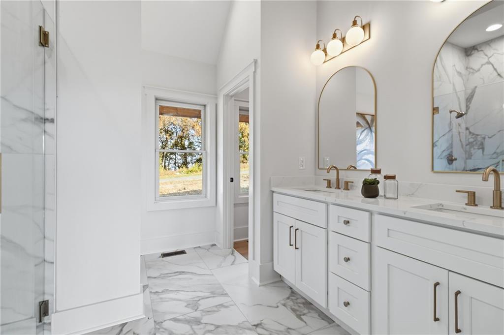 5510 Monument Road Jasper, GA 30143 - Photo 20 of 58 a spacious bathroom with double sink and a mirror